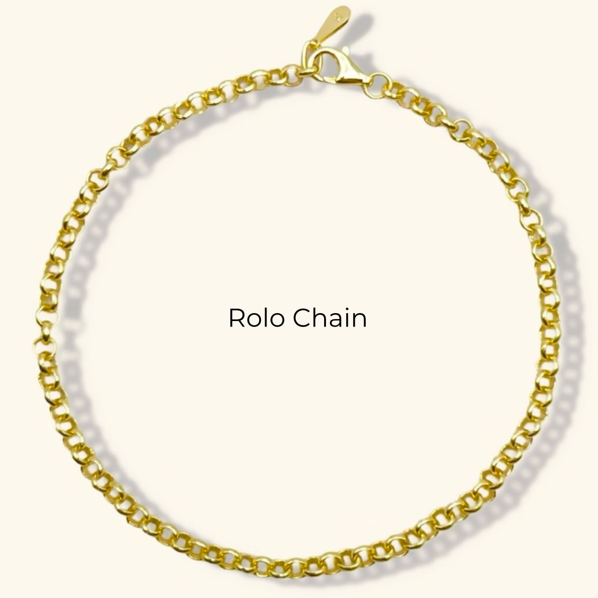 Pulsera de cadena rolo con inicial de corazón y piedra preciosa redonda