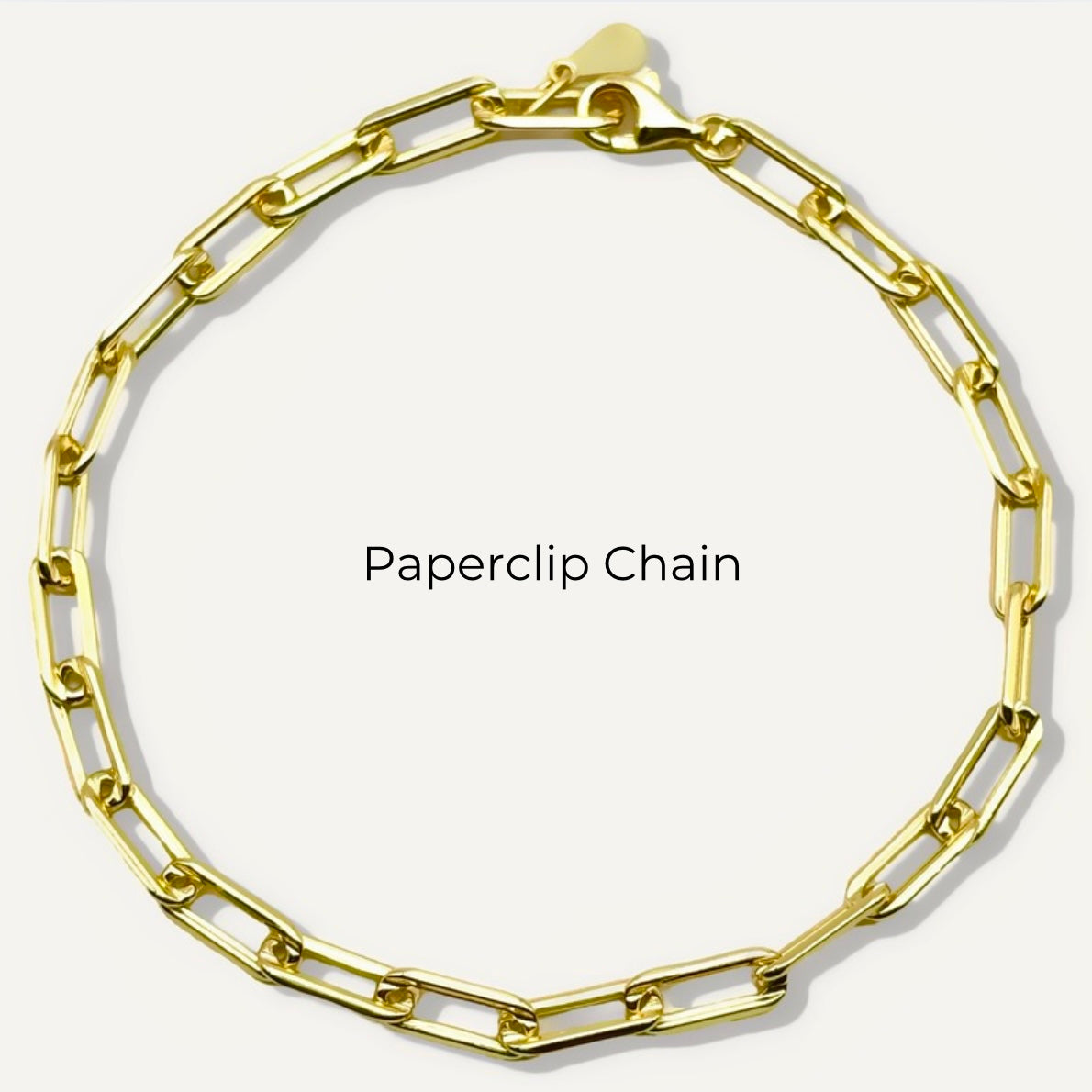 Pulsera de cadena rolo con inicial de corazón y piedra preciosa redonda