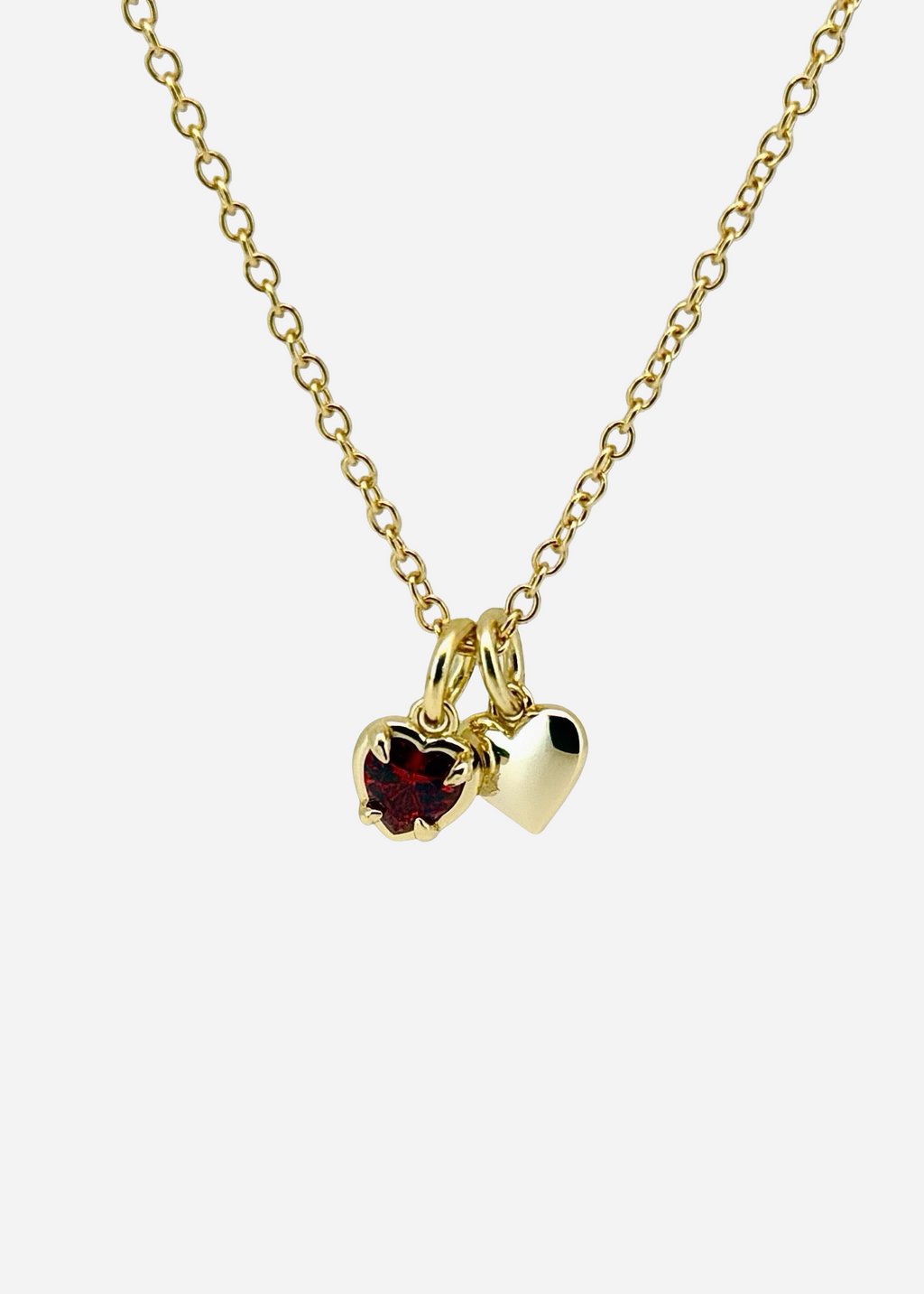 Collar con cadena tipo cable y piedra preciosa de corazón rojo con su propio corazoncito