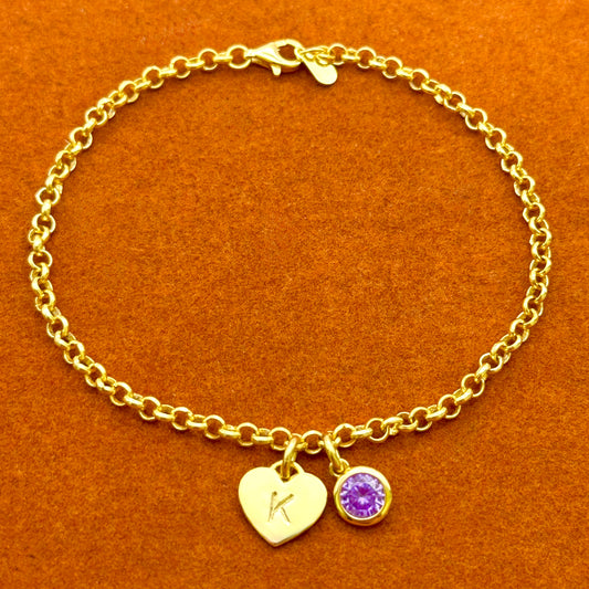 Pulsera de cadena rolo con inicial de corazón y piedra preciosa redonda