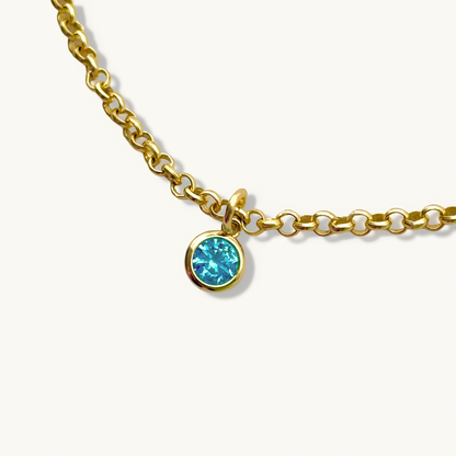 Pulsera de cadena rolo con inicial de corazón y piedra preciosa redonda