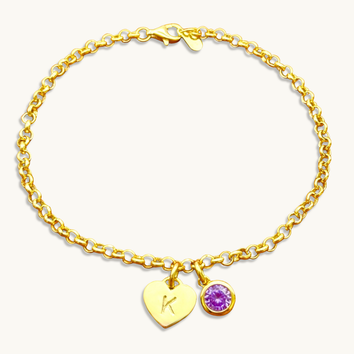 Pulsera de cadena rolo con inicial de corazón y piedra preciosa redonda