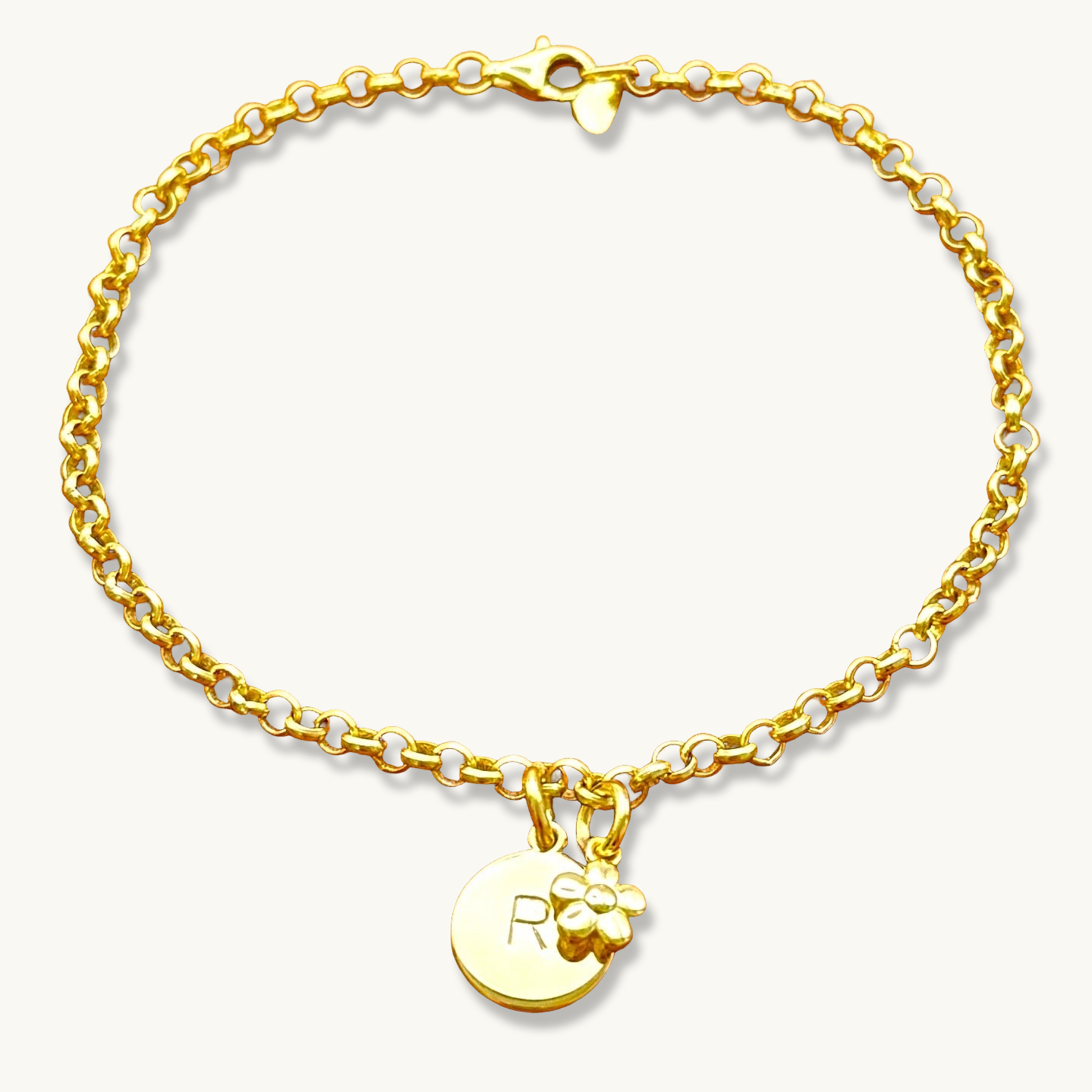 Pulsera de cadena rolo con inicial redonda y dije de flor